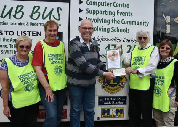 Coningsby & Tattershall Lions presented a cheque for ?500 to County Linx Radio towards their bus repairs EMN-190306-201436001