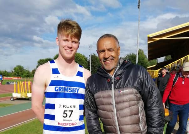 Kieran Gillespie poses for a picture with Olympic decathlete Daley Thompson.