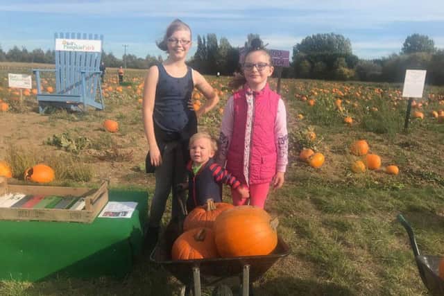 Children choosing pumpkins at last year's Pumpkin Patch.