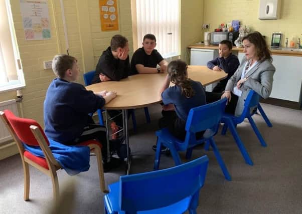 MP Victoria Atkins sits in on a school parliament meeting.