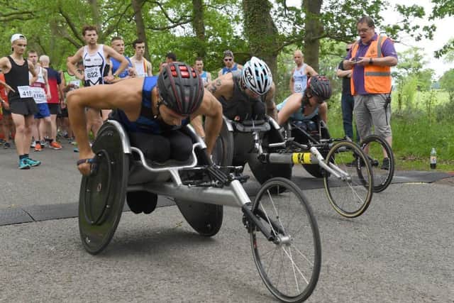 Racers at the start of the wheelchair race. EMN-190306-162104001