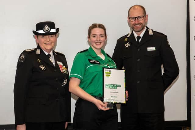 Pictured, from left: Ann Cable (Chief Volunteer), Jazmyne Evans, and Martin Houghton-Brown (Chief Executive).