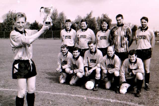 The Helpringham football team with their cup in 1994. EMN-190606-152711001