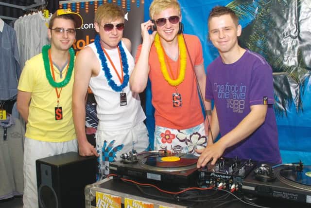 Officers Club staff (from left) Alex Gepp, Karl Wainwright and Matt Joyes enjoy the summer sounds put on by music technology student Karlie Arnold.