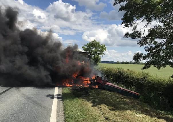 The blazing tractor on the A17 near Brant Broughton on Thursday afternoon. Photo: British Transport Police Lincolnshire. EMN-190706-175706001