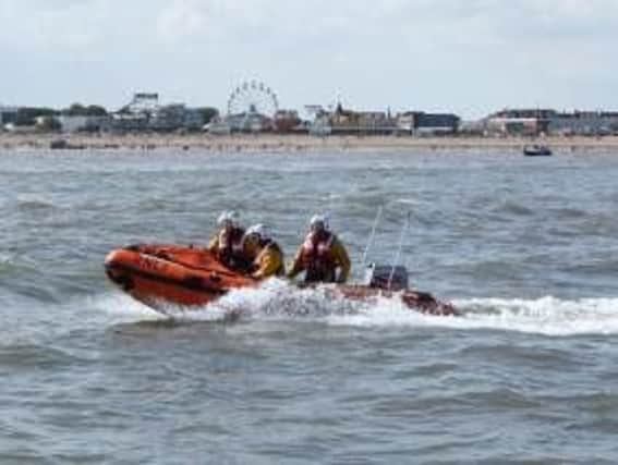 The RNLI  inshore lifeboat was launched after  reports of an inflatable dinghy being blown out to sea with two people on board.