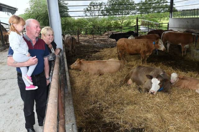 Trevor and Kim Harrison with their grand daughter Bess Harrison 2 at Minting Park Farm, Gautby.