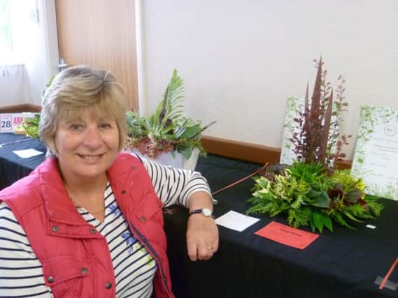 Pauline Curtis  with her winning foliage arrangement, which also took Best in Show. EMN-190617-141758001