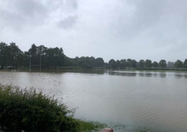 The flooded sports field at De Aston School. EMN-191206-103028001