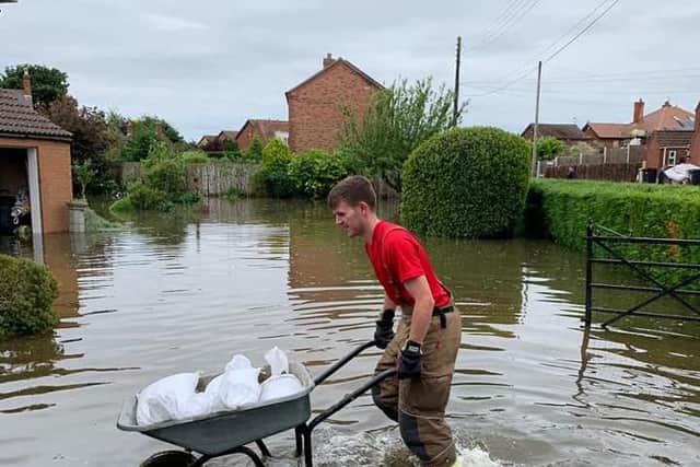 A firefighter helping with the clear-up at Wainfleet.