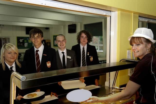 Pictured at the college's then servery, from left, were Levi Herberts, Herbie Nicholls, teacher Simon Glogiewicz, Zach Pettit and dinnerlady Catherine Jackson.