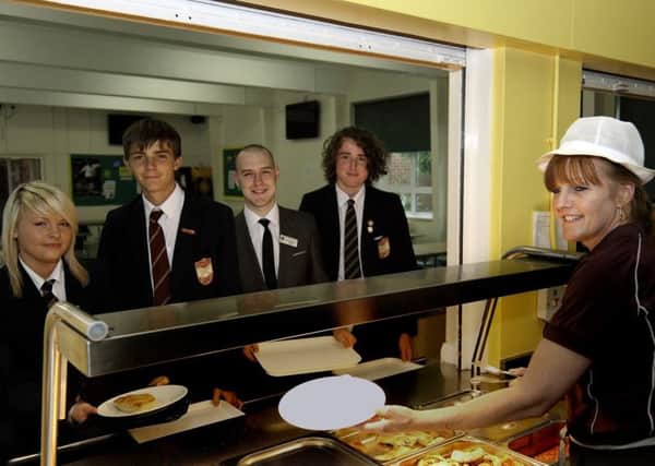 Pictured at the college's then servery, from left, were Levi Herberts, Herbie Nicholls, teacher Simon Glogiewicz, Zach Pettit and dinnerlady Catherine Jackson.