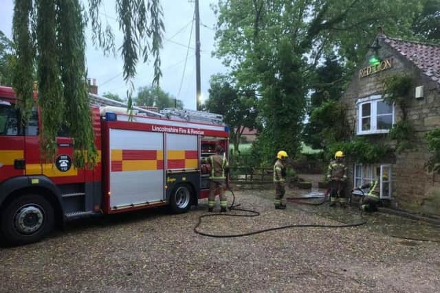 Firefighters pumping out the Red Kion at Newton. Photo: Le-Anne Askew EMN-190613-115254001