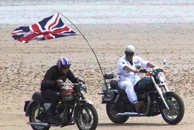 Nigel Limb (left) raced the waves in Bridlington earlier this month.