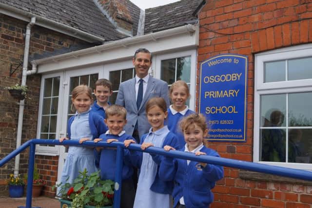 Head teacher Ashley Taylor and some of the pupils EMN-190618-104812001