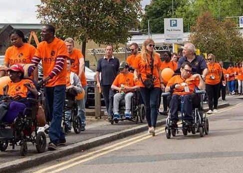Staff and people with complex disabilities from Sense participating in a Sense Walk