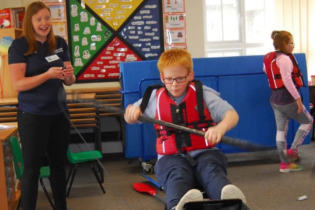 Claire Lambert of Lincoln canoe Club doing the kayak challenge with Cranwell pupils. EMN-190621-163411001