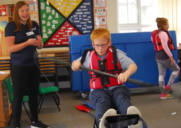 Claire Lambert of Lincoln canoe Club doing the kayak challenge with Cranwell pupils. EMN-190621-163411001