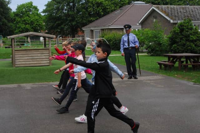 Drill instruction on the playground under Sgt Richard 'Nooky' Nauyokas. EMN-190621-162343001