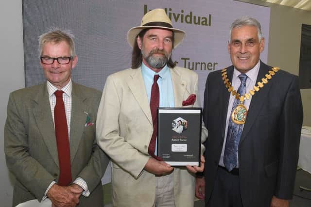 Lincolnshire County Council awards, presented by leader of LCC Martin Hill (left) and chairman of LCC Tony Bridges (right).
CCitizen of the Year is Robert Turner, of Caistor. EMN-190620-091620001