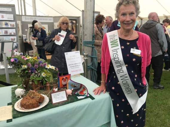 Janis Tunnerly, Lincolnshire South Federation Trustee, show secretary for the WI tent and a member of Wellingore WI praising the Down on the Farm entries.