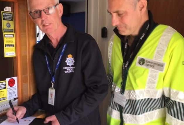 EA officers in Wainfleet signing people up to flood warnings.