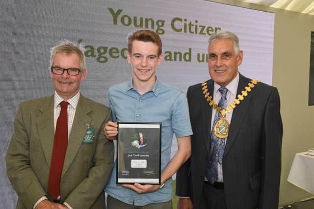 Lincolnshire County Council awards, presented by leader of LCC Martin Hill (left) and chairman of LCC Tony Bridges (right) to Young Citizen of the Year, Jack Covill-Lowndes of Wainfleet.