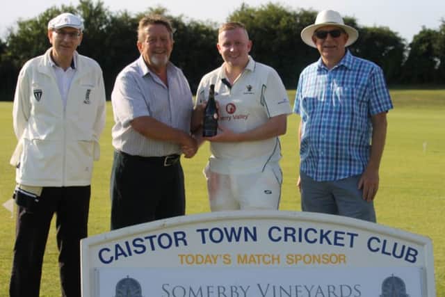 From left, umpire Brian Morris with Bill Hobson from sponsors Somerby Wines, man-of-the-match Rory Ronaldson and Caistor CC president Reg Percival. Picture: Wes Allison EMN-190624-101329002