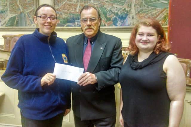 Former Mayor of Louth, Coun George Horton, presented cheques to 17 local charities and organisation.