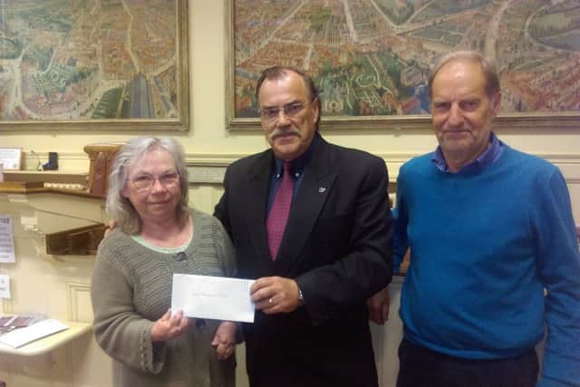 Former Mayor of Louth, Coun George Horton, presented cheques to 17 local charities and organisation.