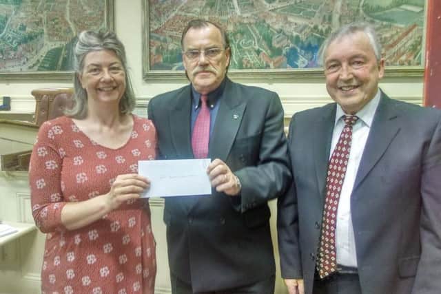 Former Mayor of Louth, Coun George Horton, presented cheques to 17 local charities and organisation.