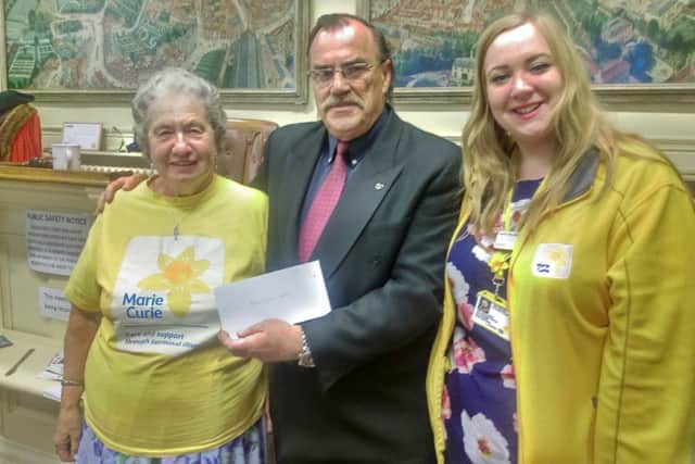 Former Mayor of Louth, Coun George Horton, presented cheques to 17 local charities and organisation.