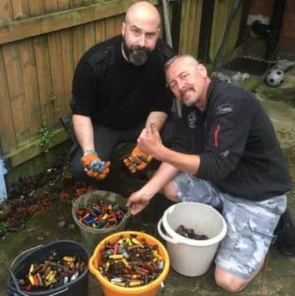 Ben Sharpe, left, and Wayne Burley with their haul of old shotgun shells.