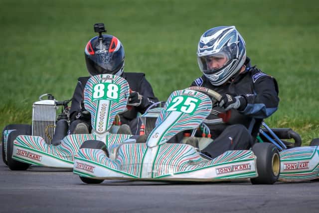 Mablethorpes Josh Howell (25) fends off Louths Michael North (88) during one of their epic Max-177 battles PICTURE: Paul Denton EMN-190625-090243002