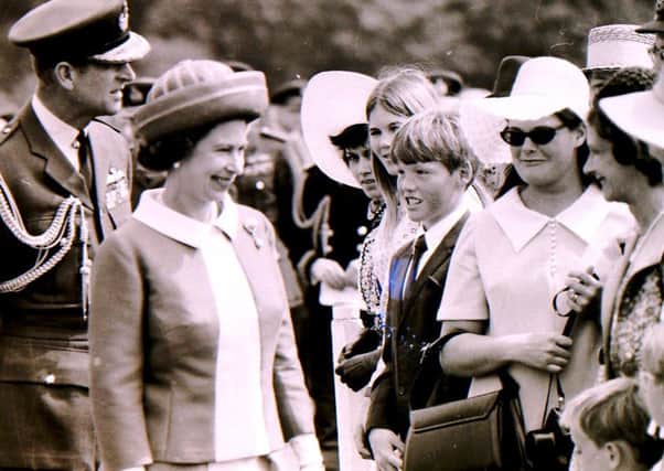 The Queen meets well wishers in the crowd at RAF College Cranwell when she visited to celebrate its 50th anniversary in June 1970. EMN-190628-094249001