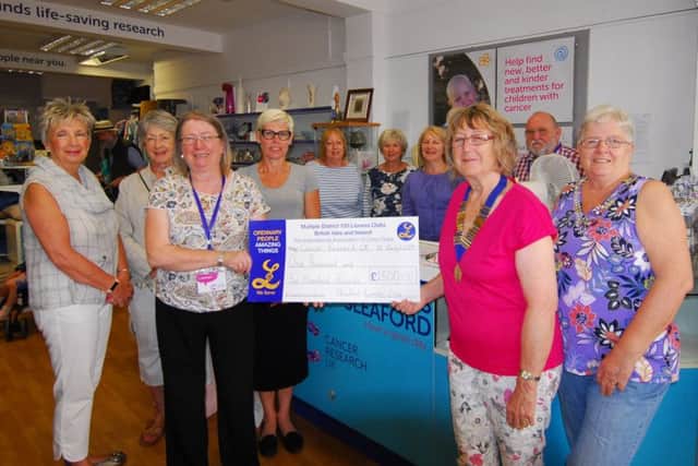 olunteers and Lionesses are pictured with shop manager Anne Brown (left) and Lioness President Pam Kyte (right), who is also a shop volunteer. EMN-190107-144800001