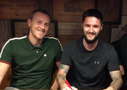 Dominic Knowles signs on, with Craig Elliott.