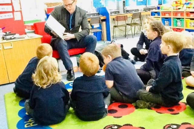 Ryan Hinson during a lesson with young pupils.