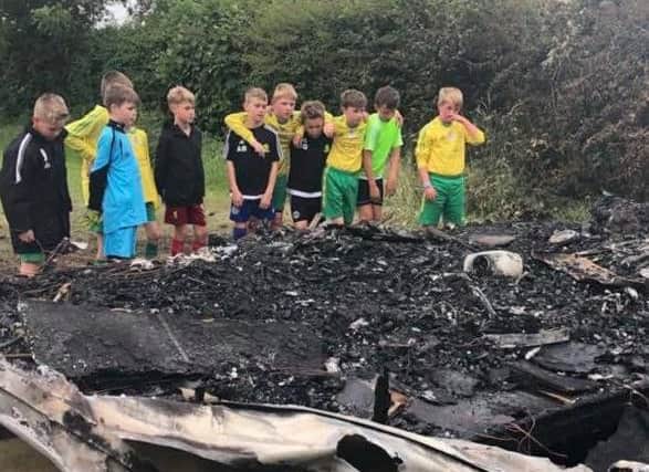It's heartbreaking. Members of East Coast Juniors discover the fire that has destroyed their kit.