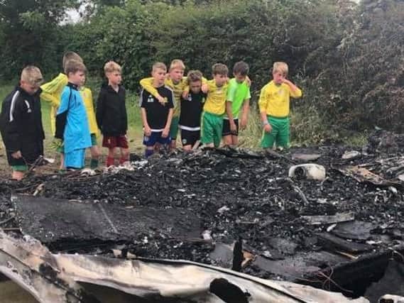 It's heartbreaking. Members of East Coast Juniors discover the fire that has destroyed their kit.