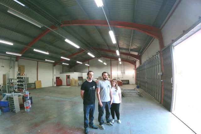 Darren and Heather Thompson with Jason Hill, who will be a supervisor at the facility.