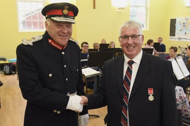 Former Director of Music of Sleaford Concert Band, Jim McQuade receiving BEM from Lord Lieutenant Toby Dennis in October of last year.
