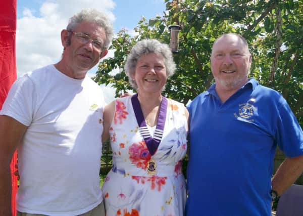 Elisabeth Eastburn is Market Rasen Lions' new president. Pictured with past president Gary Eastburn, right, and district governor Ron Lyus EMN-190907-092025001
