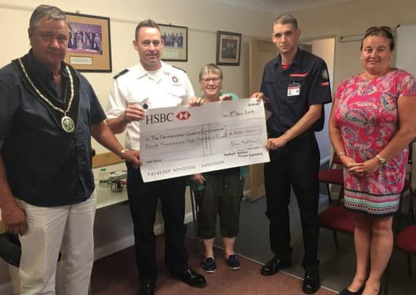 Mayor John Matthews presents a cheque to Lincolnshire Fire and Rescue EMN-190507-151214001