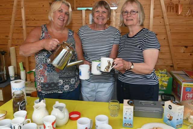 Craft fair and garden party in aid of British Legion poppy appeal. L-R Anne Turner, Barbara Baxter and Susan Moore serving teas. EMN-190807-114238001