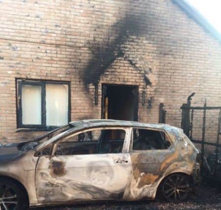 The burnt out car in Harrow Drive, Skegness. ANL-190807-153703001