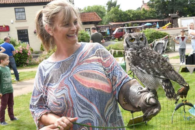 Digby Fayre. Heidi Bailey with an African Spotted owl called Ozzy, owned by Derek Tindle Birds of Prey EMN-190807-114321001