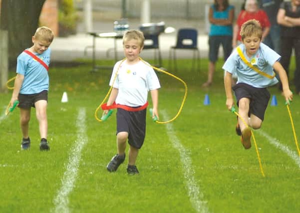 Pictured in the skipping race, from left, Harry Edwards, Adam Good and Kian Mothers.