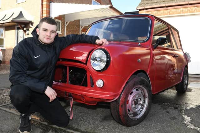 Young Restorer of the Year 2018, Josh Smith of Sleaford, pictured with his Mini that he is restoring. He is now embarking on a new, fundraising challenge. EMN-191107-135356001