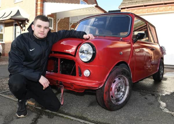 Young Restorer of the Year 2018, Josh Smith of Sleaford, pictured with his Mini that he is restoring. He is now embarking on a new, fundraising challenge. EMN-191107-135356001